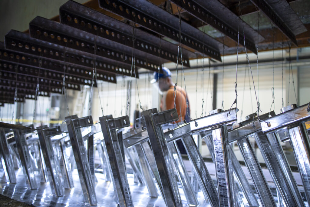 Metal parts being treated with zinc coating.